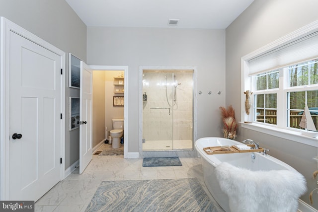 765 Blueberry Ct, Huntingtown, MD 20639 - full bathroom with baseboards, toilet, a soaking tub, a shower stall, and marble finish floor