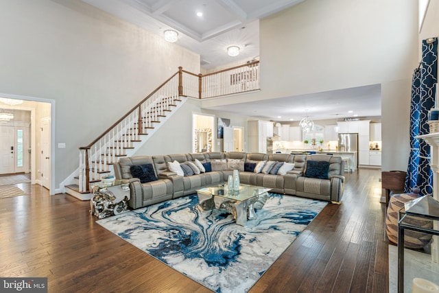 765 Blueberry Ct, Huntingtown, MD 20639 - living area with a chandelier, hardwood / wood-style flooring, a towering ceiling, stairs, and coffered ceiling