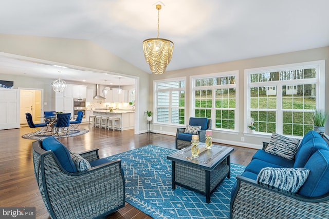 765 Blueberry Ct, Huntingtown, MD 20639 - living area with wood finished floors, an inviting chandelier, and lofted ceiling