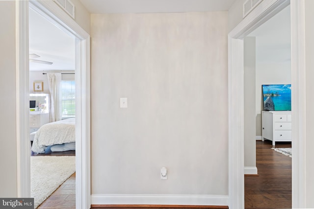765 Blueberry Ct, Huntingtown, MD 20639 - hall with visible vents, baseboards, and wood finished floors