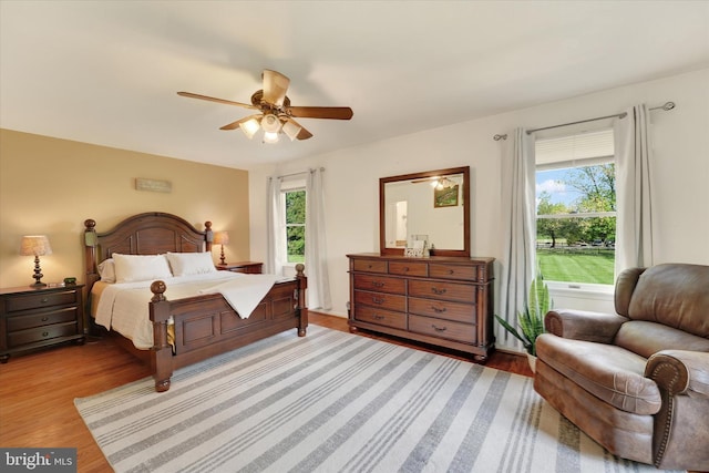 bedroom with light wood finished floors and ceiling fan