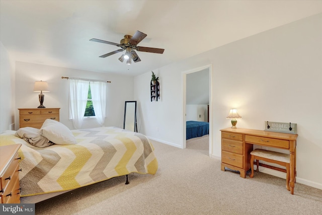 bedroom featuring a ceiling fan, baseboards, and light colored carpet
