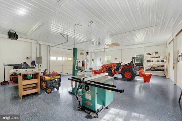 garage featuring a garage door opener and electric panel