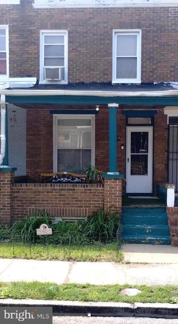 2309 Lauretta Ave, Baltimore, MD 21223 - property entrance with a porch and brick siding