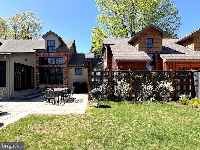 451 E Hamilton Ave, State College, PA 16801 - rear view of property featuring a shingled roof, board and batten siding, fence, and a yard
