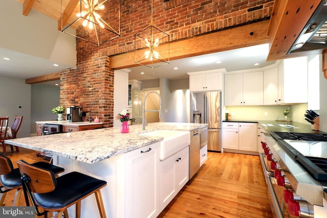 451 E Hamilton Ave, State College, PA 16801 - kitchen with white cabinetry, premium appliances, a sink, and a high ceiling