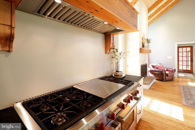 451 E Hamilton Ave, State College, PA 16801 - kitchen featuring light wood-style floors, cooktop, lofted ceiling with beams, and custom range hood