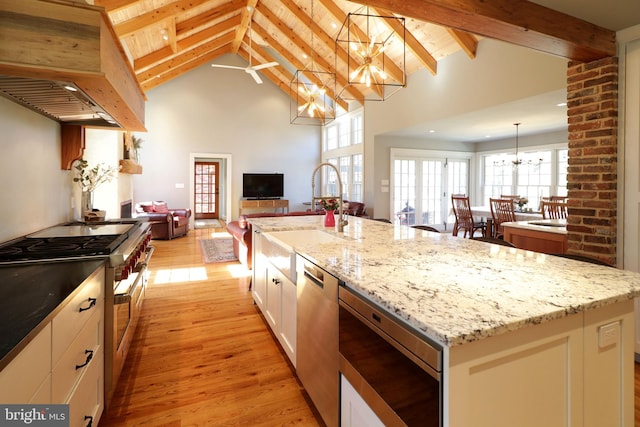 451 E Hamilton Ave, State College, PA 16801 - kitchen with a notable chandelier, appliances with stainless steel finishes, a sink, light wood finished floors, and high vaulted ceiling