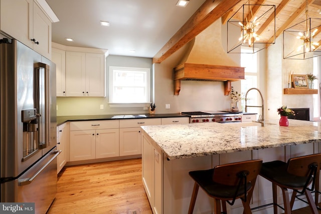 451 E Hamilton Ave, State College, PA 16801 - kitchen with a sink, light wood finished floors, a chandelier, a breakfast bar, and high end fridge