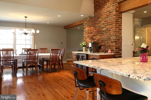 451 E Hamilton Ave, State College, PA 16801 - dining room featuring light wood finished floors, wine cooler, beam ceiling, and a notable chandelier