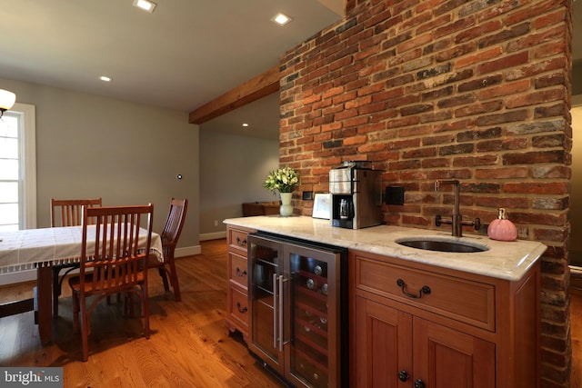 451 E Hamilton Ave, State College, PA 16801 - bar featuring wet bar, a sink, baseboards, light wood finished floors, and beverage cooler