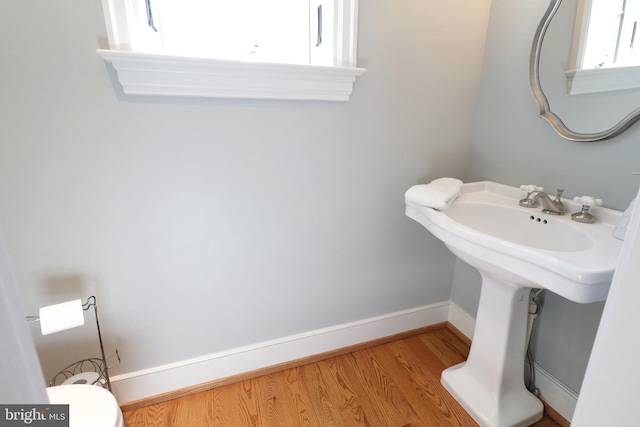 451 E Hamilton Ave, State College, PA 16801 - bathroom featuring baseboards, a sink, wood finished floors, and toilet