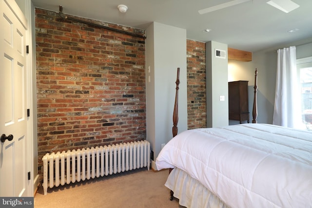 451 E Hamilton Ave, State College, PA 16801 - carpeted bedroom with brick wall, visible vents, and radiator heating unit