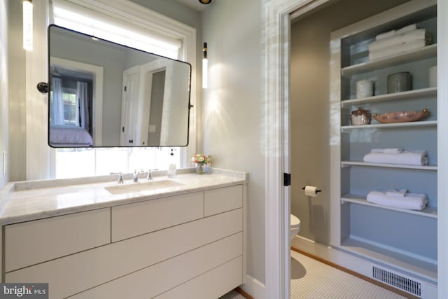 451 E Hamilton Ave, State College, PA 16801 - bathroom with vanity, toilet, and visible vents