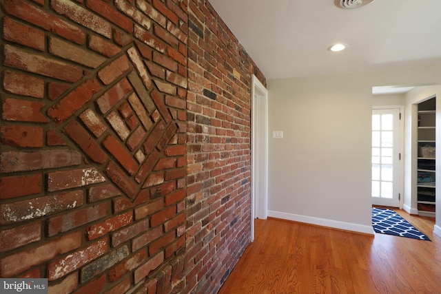 451 E Hamilton Ave, State College, PA 16801 - hallway featuring brick wall, baseboards, and wood finished floors