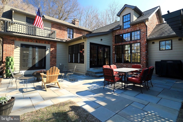 451 E Hamilton Ave, State College, PA 16801 - back of property featuring a balcony, a patio, french doors, brick siding, and entry steps