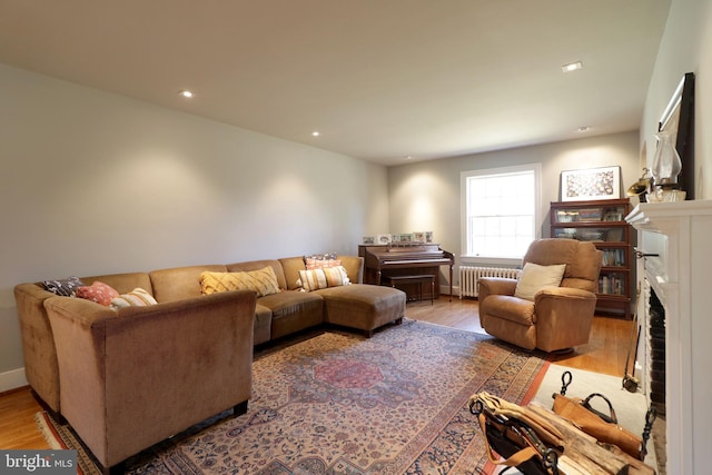 451 E Hamilton Ave, State College, PA 16801 - living room with radiator heating unit, a fireplace, recessed lighting, and wood finished floors