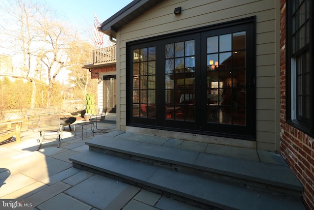 451 E Hamilton Ave, State College, PA 16801 - property entrance with french doors, a patio area, brick siding, and a balcony