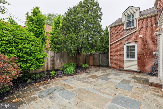 view of patio / terrace with fence and a gate