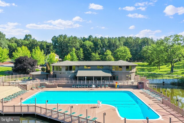 1617 Winter Camp Trl, Hedgesville, WV 25427 - community pool with a water view, fence, and a patio area