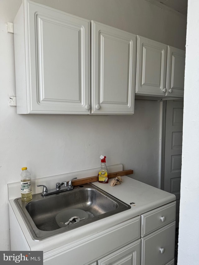 1725 N Creighton St, Philadelphia, PA 19131 - kitchen with white cabinets, light countertops, and a sink
