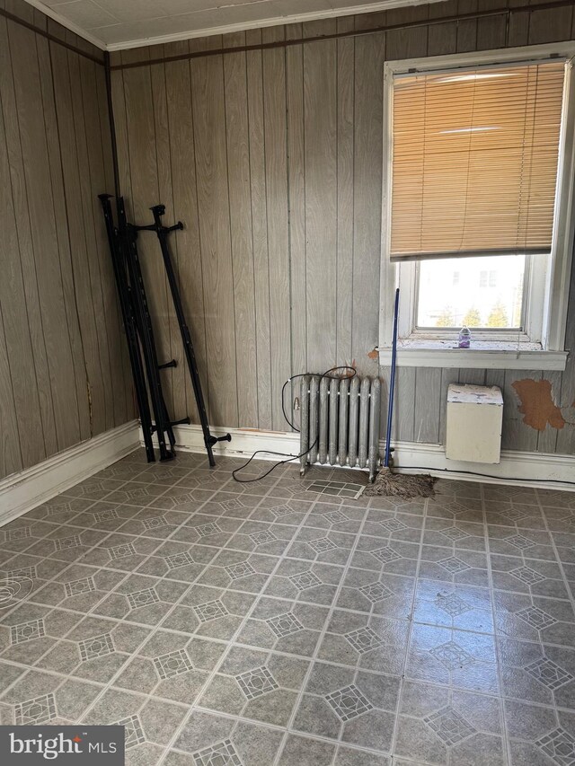 1725 N Creighton St, Philadelphia, PA 19131 - unfurnished room with wood walls, radiator, and baseboards