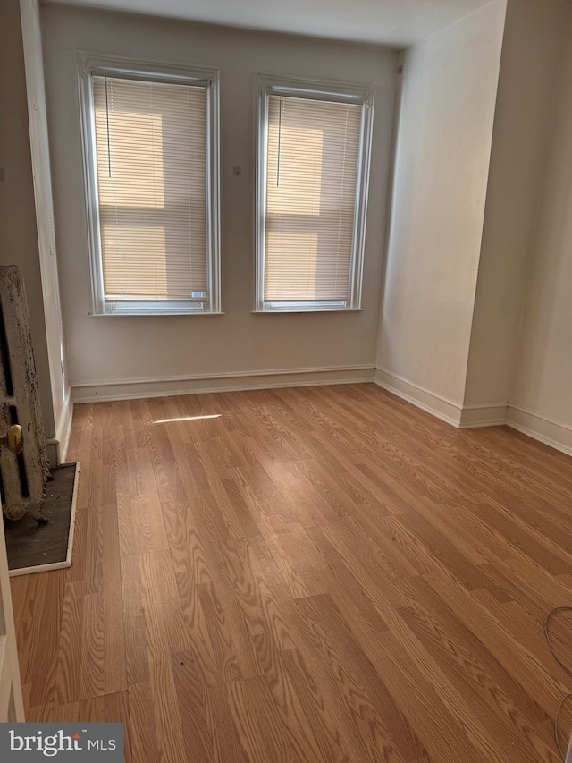 1725 N Creighton St, Philadelphia, PA 19131 - unfurnished room featuring baseboards, a healthy amount of sunlight, and wood finished floors
