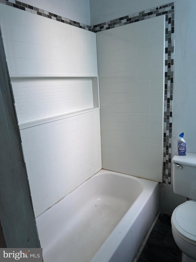 1725 N Creighton St, Philadelphia, PA 19131 - bathroom featuring toilet, a tub to relax in, and wood finished floors