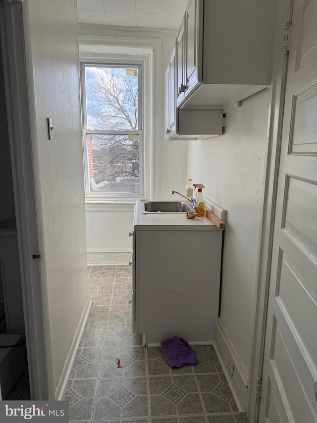 1725 N Creighton St, Philadelphia, PA 19131 - bathroom featuring baseboards, tile patterned floors, and a sink