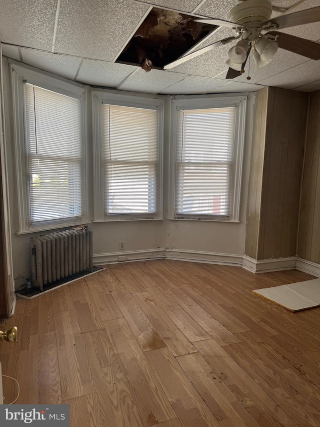 1725 N Creighton St, Philadelphia, PA 19131 - spare room featuring radiator, light wood-style floors, and a ceiling fan