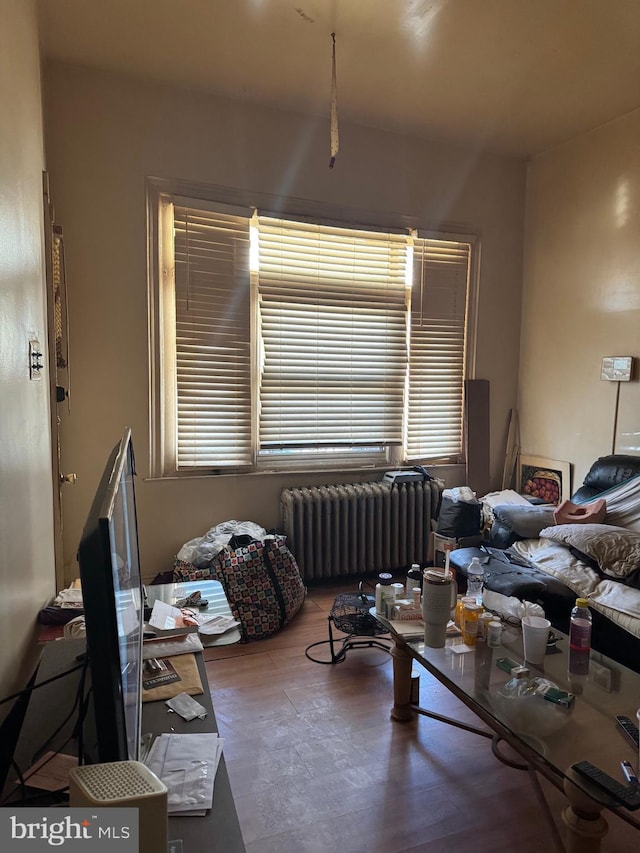 1725 N Creighton St, Philadelphia, PA 19131 - living area featuring radiator and wood finished floors