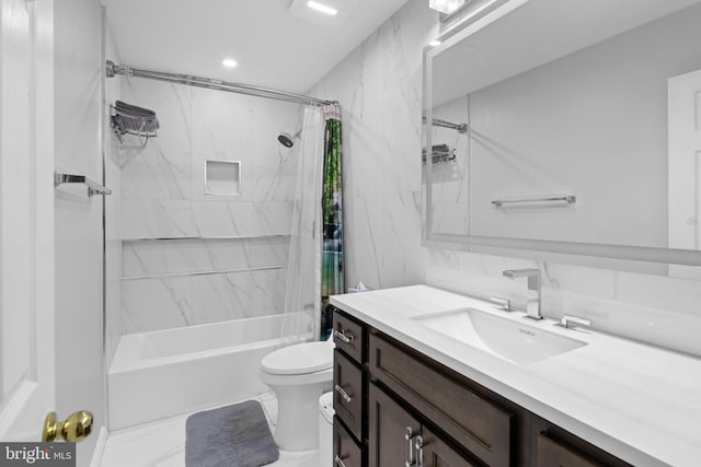 bathroom with shower / bath combo with shower curtain, toilet, and vanity