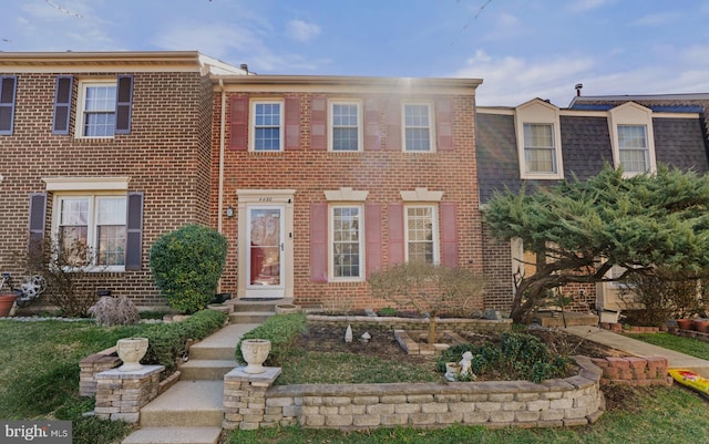 view of property with brick siding
