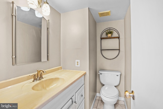 half bath featuring tile patterned flooring, vanity, toilet, baseboards, and visible vents