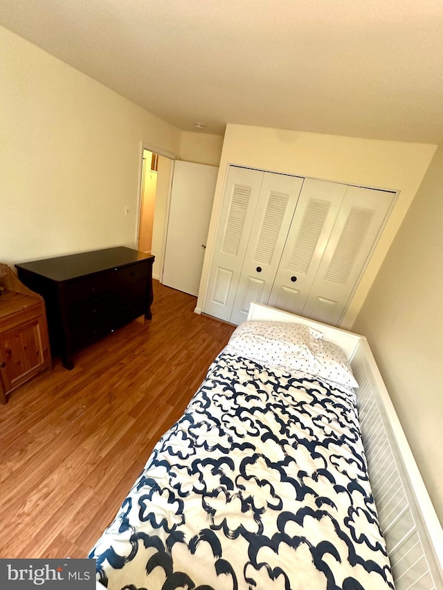 bedroom featuring wood finished floors