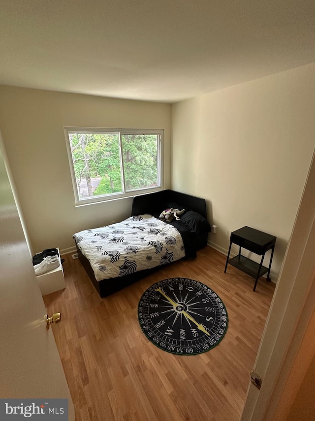 bedroom with wood finished floors