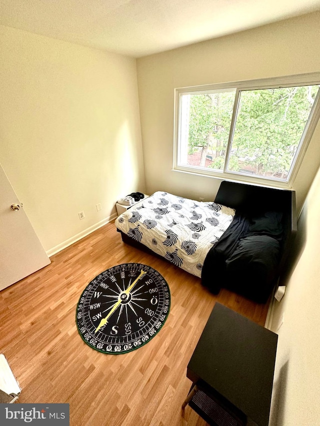 bedroom featuring wood finished floors