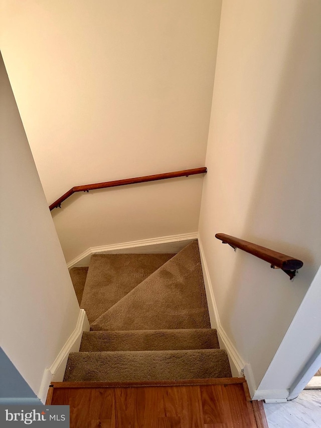 staircase with baseboards