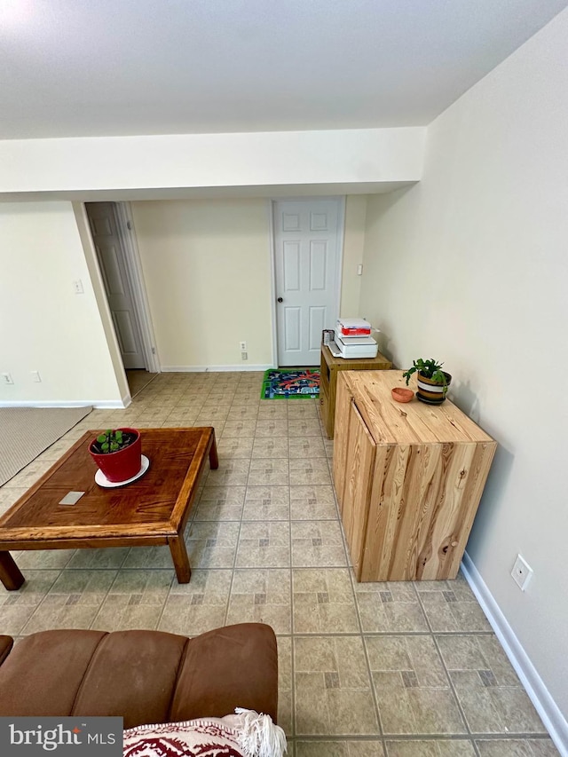 finished basement featuring baseboards