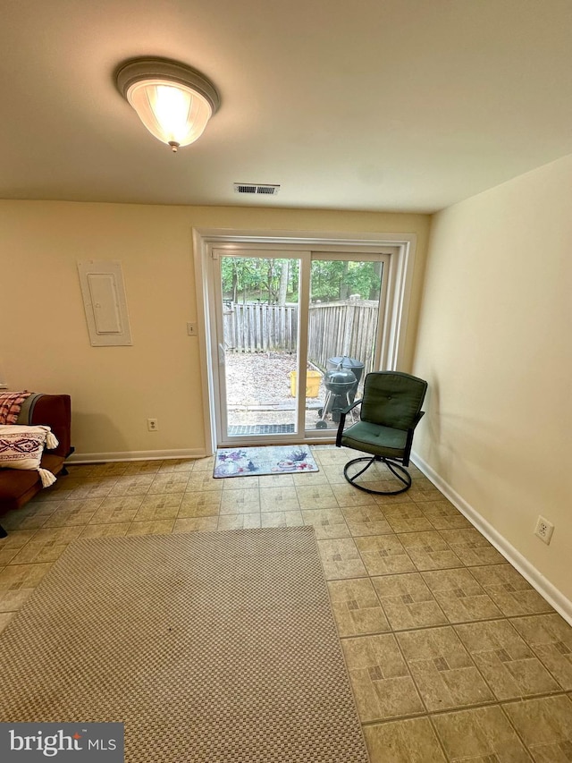 sitting room featuring baseboards