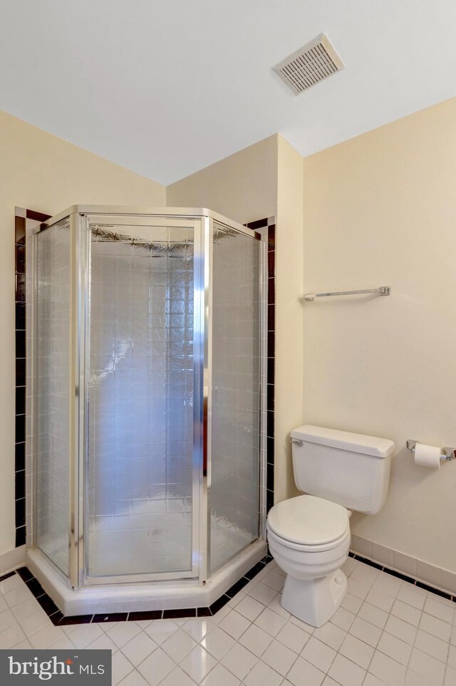 full bathroom featuring tile patterned floors, visible vents, a shower stall, and toilet