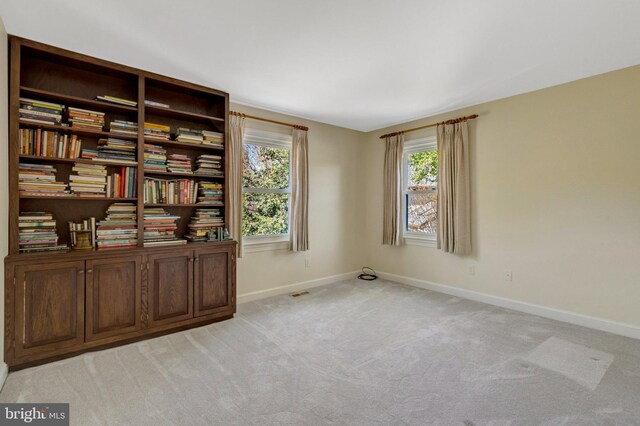 interior space featuring baseboards and visible vents