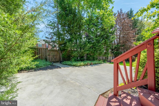 view of patio / terrace featuring fence and a gate