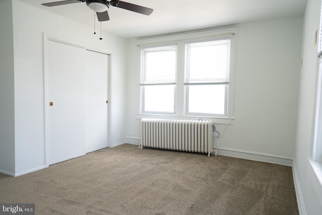 8 Oakley Rd, Upper Darby, PA 19082 - unfurnished bedroom featuring radiator, carpet, a closet, and ceiling fan
