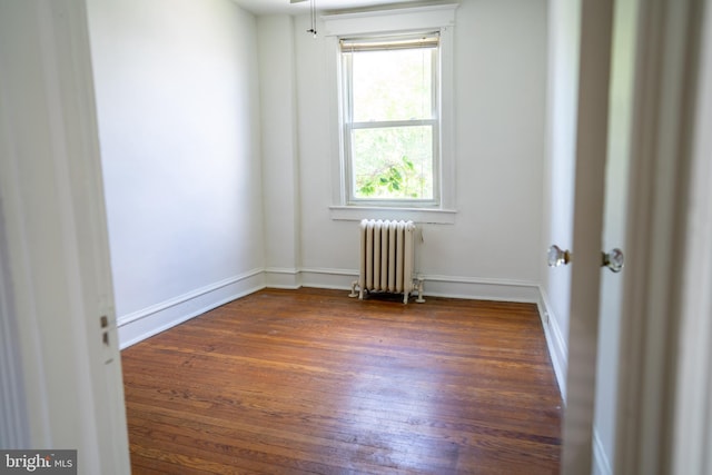 8 Oakley Rd, Upper Darby, PA 19082 - unfurnished room featuring radiator and dark wood-style floors