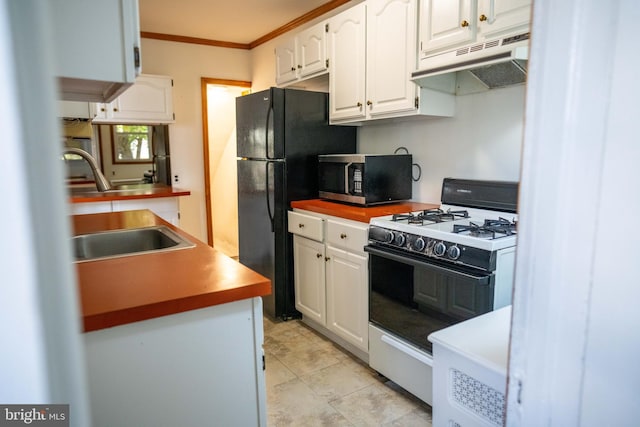 8 Oakley Rd, Upper Darby, PA 19082 - kitchen featuring stainless steel microwave, white gas range, under cabinet range hood, white cabinetry, and crown molding