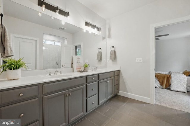 122 Boxelder Dr, Stafford, VA 22554 - ensuite bathroom with a shower stall, double vanity, baseboards, and tile patterned floors