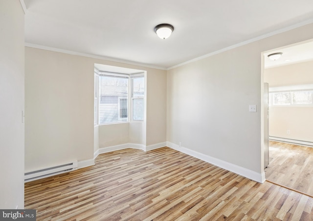 909 Spruce Ave, Pleasantville, NJ 08232 - unfurnished room with a healthy amount of sunlight, wood finished floors, a baseboard heating unit, and crown molding