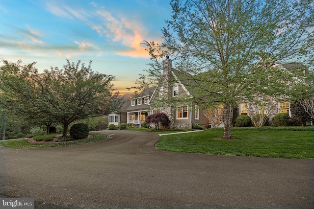 11820 Plantation Dr, Great Falls, VA 22066 - view of front of property with a chimney, driveway, and a front yard