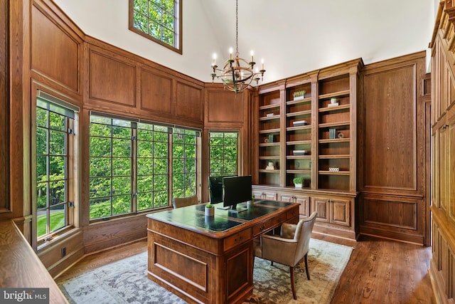 11820 Plantation Dr, Great Falls, VA 22066 - office area featuring a high ceiling, a notable chandelier, a healthy amount of sunlight, and wood finished floors